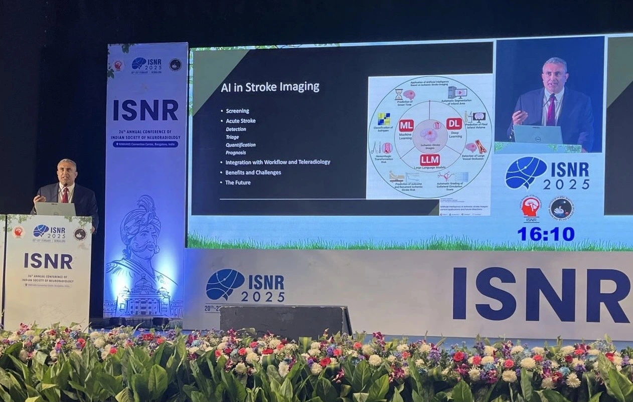 Dr. Arjun Kalyanpur speaking at ISNR 2025,